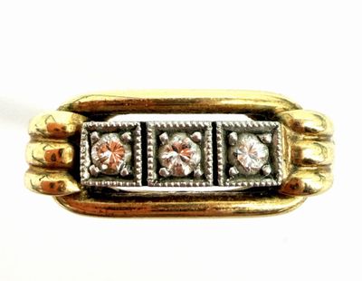 an image of a gold and silver ring with three diamonds