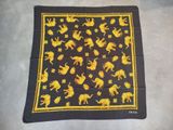 a black and yellow scarf with yellow elephants on it