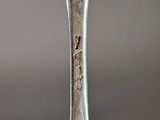 a close up of a spoon with a fork in the middle of it