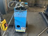 a blue machine that is sitting on the floor