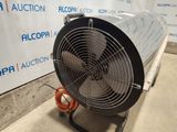 a fan that is sitting on a cart in a room