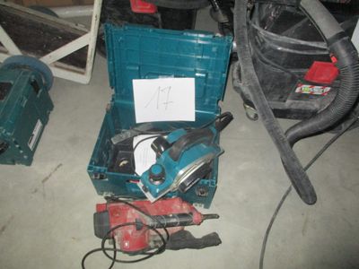 a blue tool box with tools in it on the floor