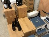 many boxes and bottles of wine on the floor