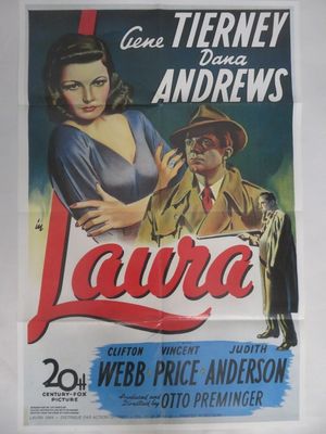 une vieille affiche de cinéma représentant une femme coiffée d'un chapeau et un homme en costume