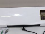 an image of a white air conditioner sitting on top of a counter