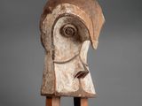 a close up of a wooden sculpture of a woman ' s head