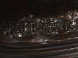 a close up of a bronze statue of a man