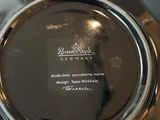 a black plate with a white writing on it