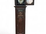 a tall wooden grandfather clock with a mirror on top of it