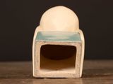 a white and blue object on a wooden table