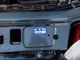 a blue license plate on the back of a truck