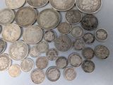 a lot of coins that are on the table