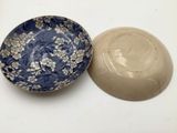 a small bowl and a small bowl sitting on a table