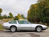 a white sports car parked on the side of the road