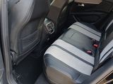 two seats in the back of a car with a seat belt