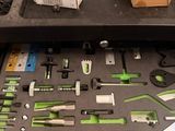 a box of tools sitting on a table next to a pair of scissors