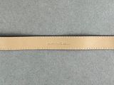 a tan leather watch strap with a white stitching on it