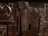 a close up of a wooden cabinet with a lock on it