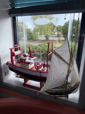 a model of a boat on display in a window
