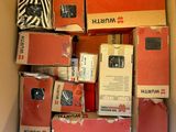 a cardboard box filled with many different types of electronic devices