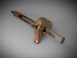 a small wooden tool that is on top of a table