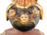 an image of a statue of a woman holding a child on her back