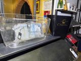 a clear container with a toothbrush and toothpaste inside of it