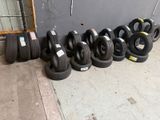 a lot of tires that are lined up on the ground