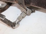 a close up of a pair of clamps attached to a piece of metal