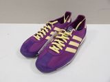 a pair of purple and yellow sneakers with yellow laces