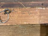 a piece of wood with writing on it and a key