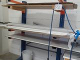 a workbench in the middle of a room with two buckets on it