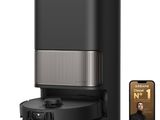 an image of a black coffee maker next to a smart phone