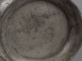 a silver cup that is sitting on a table