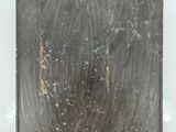 a picture of a dirty mirror on a white surface