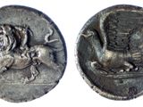 a close up of a coin with a lion on it