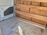 a white van that is parked inside of a building