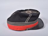 a black hat with a red band on it