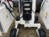 a small machine that is sitting on the ground