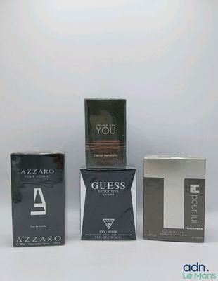 four different types of perfumes in boxes on a white background