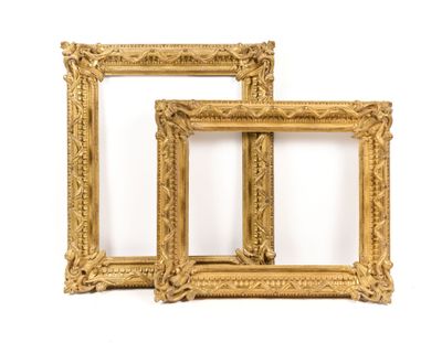 two gold picture frames on a white background with a white background