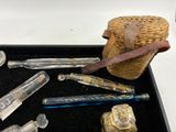 a black tray with a bunch of glass items on it