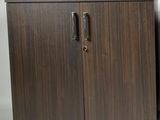 a pair of mid century style walnut cabinets with metal handles