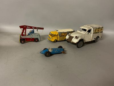 four toy cars that are sitting next to each other