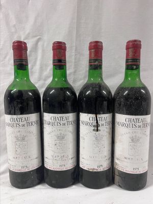 four bottles of wine are lined up on a white surface