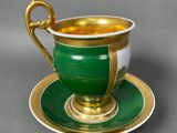 a cup and saucer on a saucer on a table