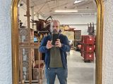 a man taking a picture of himself in a mirror