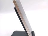 a cell phone that is sitting on top of a stand
