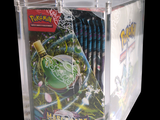 a clear box with a bunch of pokemon cards inside of it