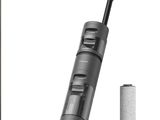 a close up of a vacuum and a battery on a white background